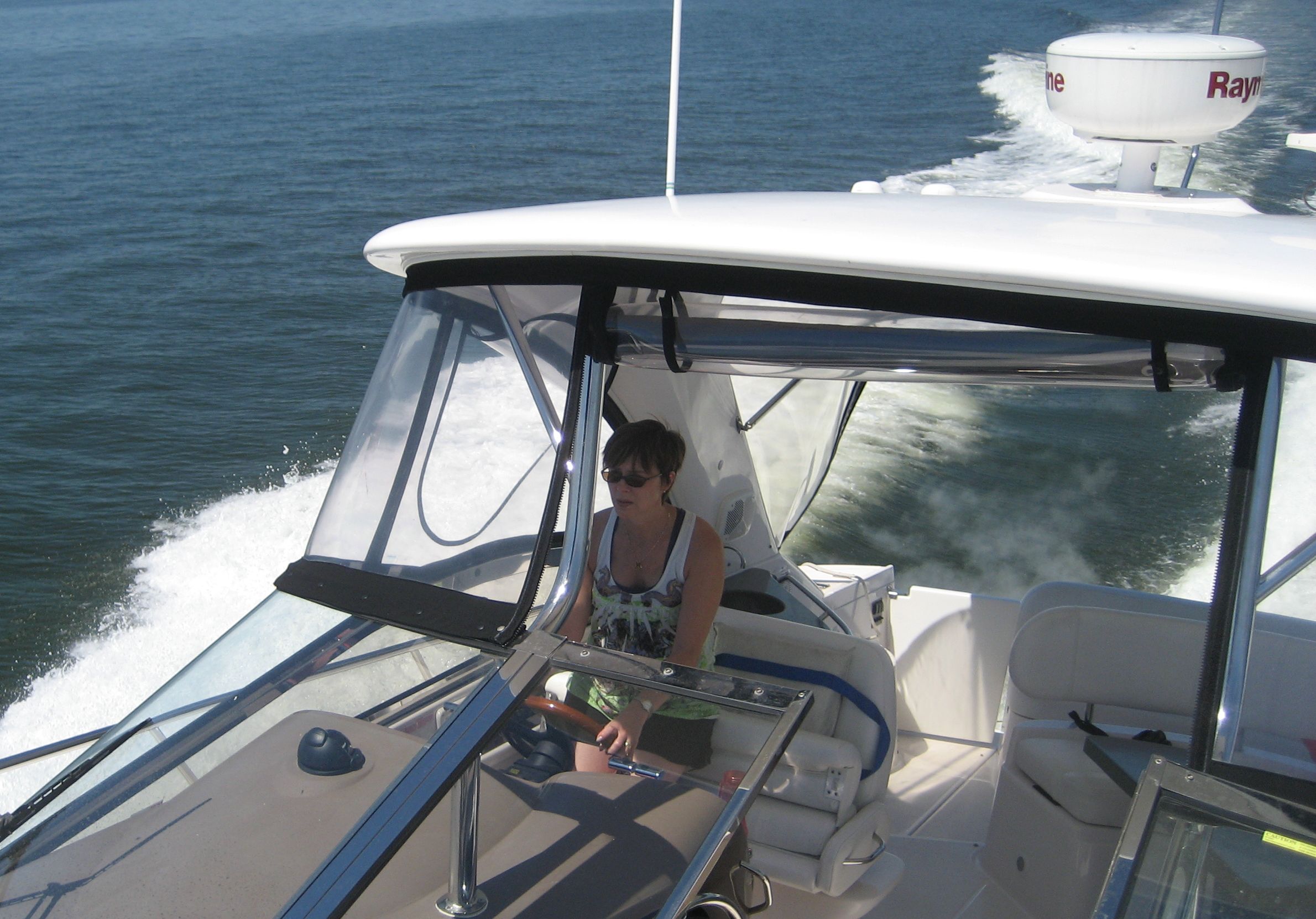 Stacey at the Helm of a Regal 4060